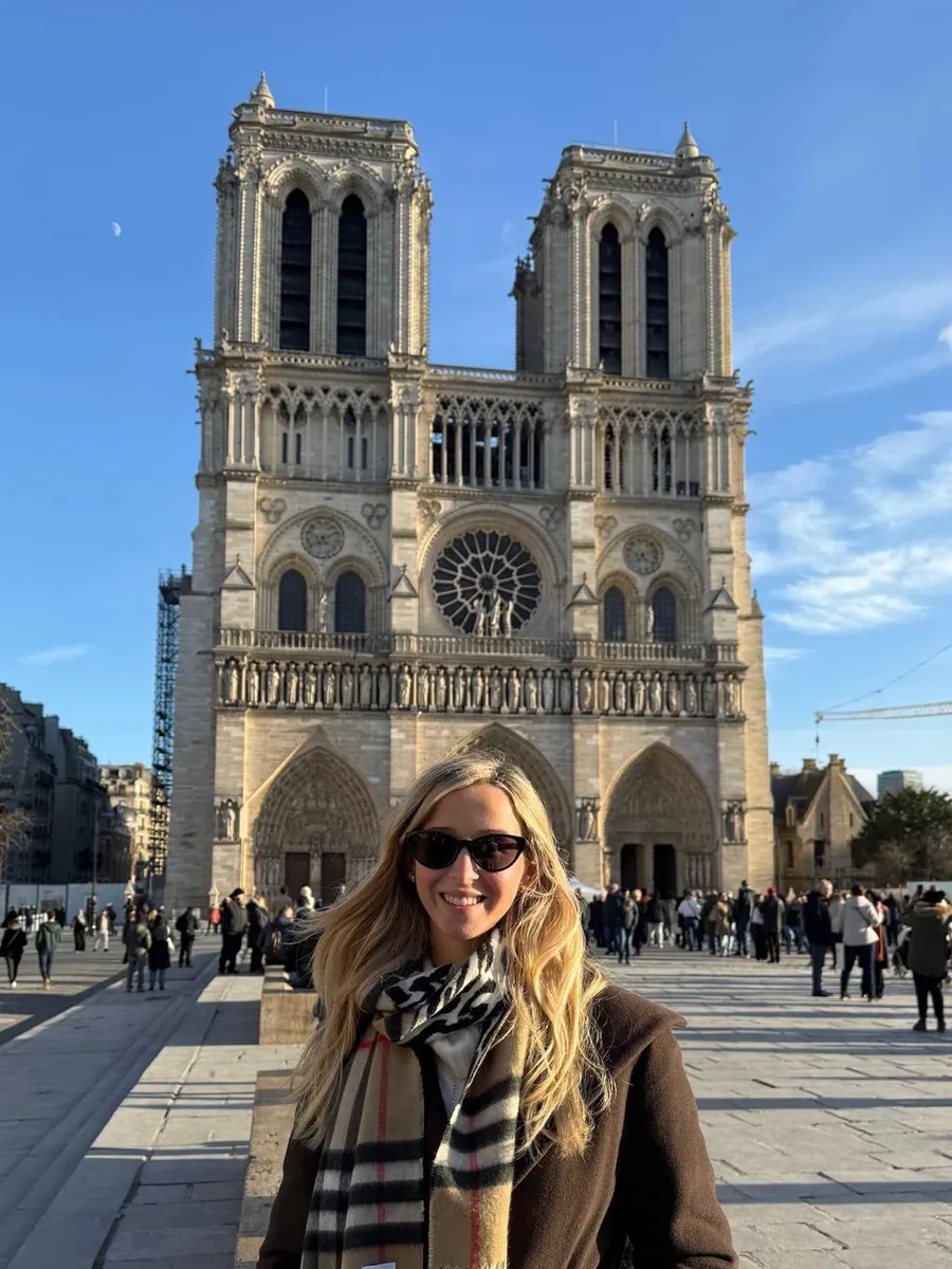 Katelyn in front of Notre-Dame on a clear winter morning.